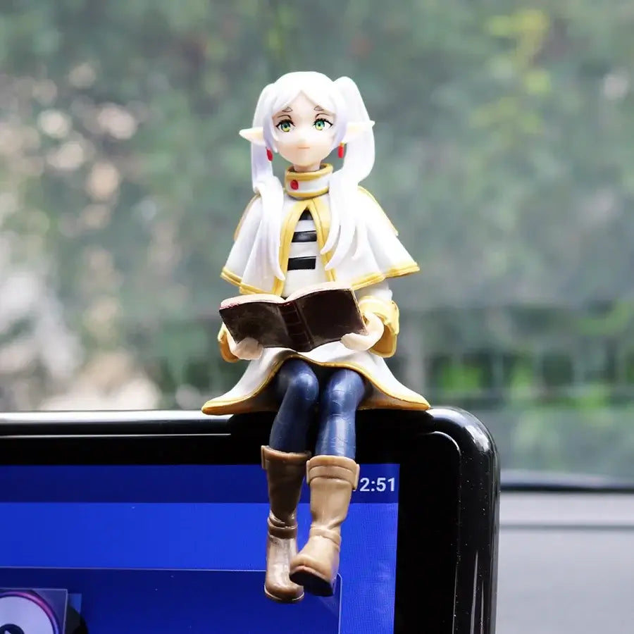 A high-quality 14cm Frieren Anime Figure sitting down, functioning as a noodle stopper and desktop decoration.