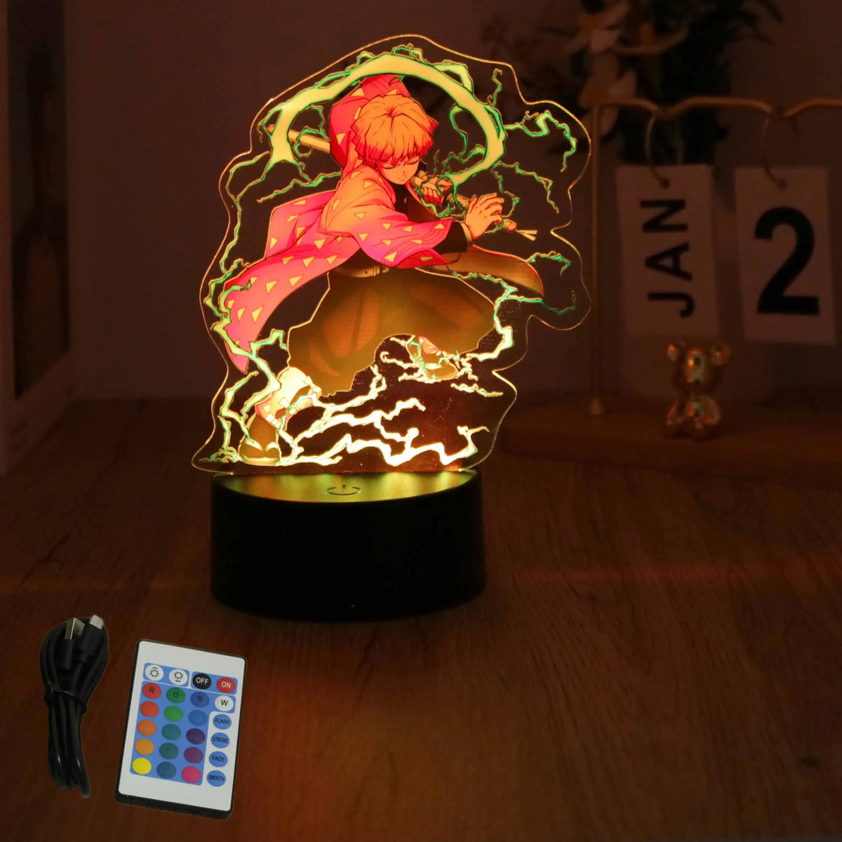 A glowing Demon Slayer 3D Lamp featuring an acrylic Tanjiro and Nezuko figure design, illuminated in blue LED light for bedroom decor.