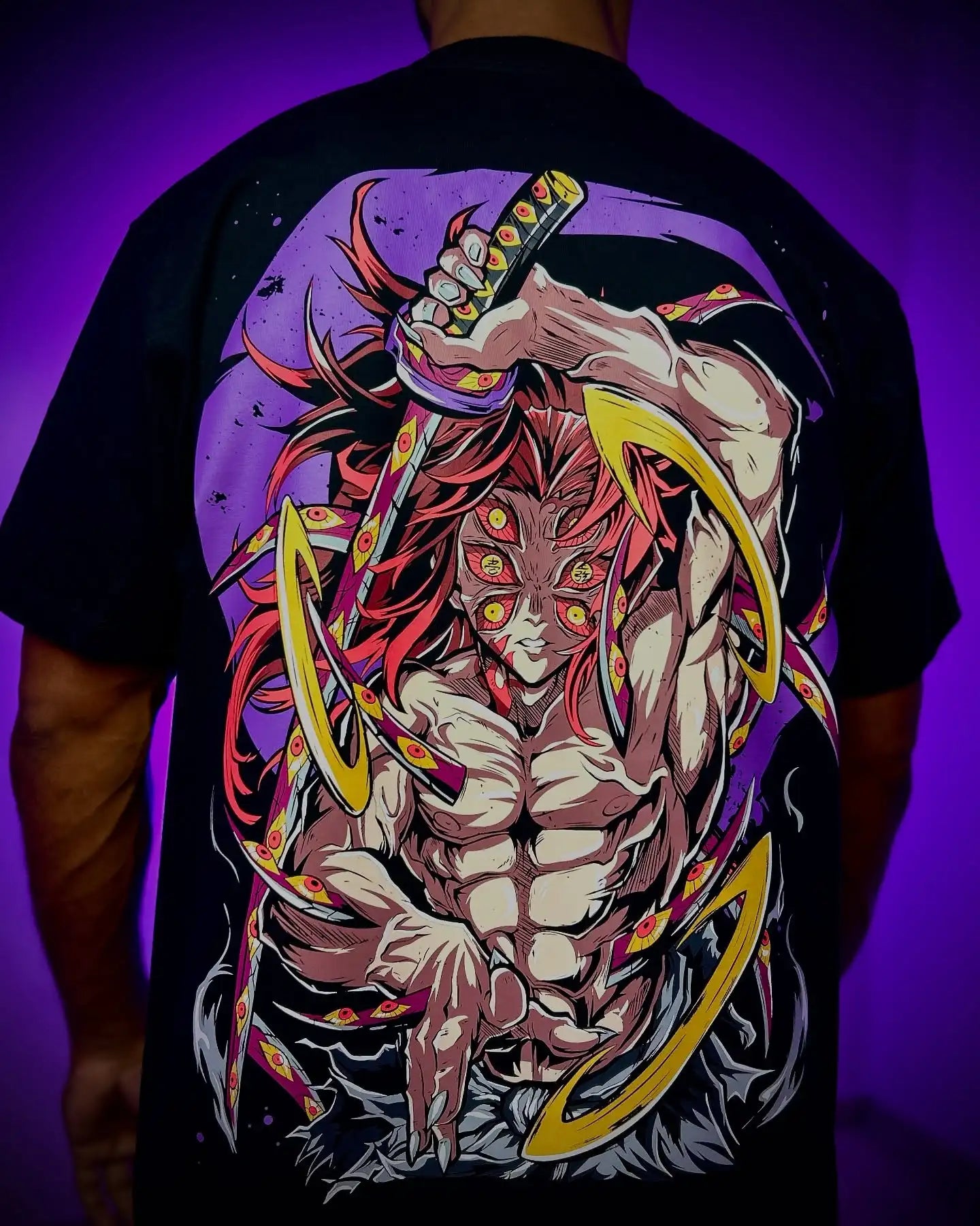 A couple wearing matching oversized Demon Slayer Graphic T Shirts in a hip hop, Y2K streetwear style.