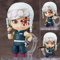 High-quality Demon Slayer Nendoroid Figures featuring Kamado Tanjiro, Nezuko, and Uzui Tengen posing for an upscale anime collection display.
