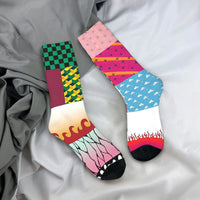 Breathable Demon Slayer Socks featuring Nezuko Kamado and Giyu Tomioka patterns, designed as trendy non-slip skateboard stockings for men and women.