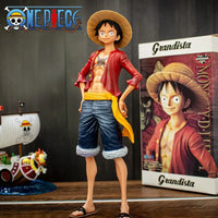 A 28cm One Piece Luffy Figure made of PVC, featuring three interchangeable face plates showing confident and smiley expressions for custom display.