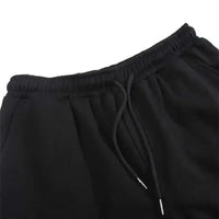 A pair of pure cotton Tokito Muichiro Jogger Pants featuring Japanese anime Demon Slayer graphic prints, designed as casual men's sport trousers.