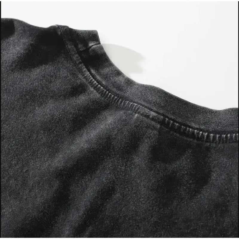 Close-up view of the neckline of the Dark Manga Pattern T-Shirt showcasing its soft fabric and stitching detail.