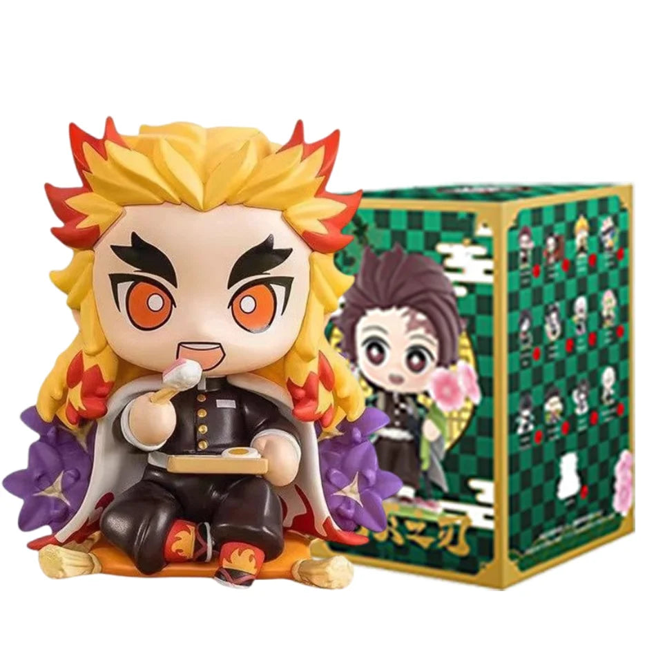 A colorful Demon Slayer Blind Box containing a random cute PVC anime figure of Tanjiro or Nezuko, used as a desktop ornament.