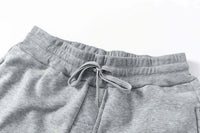 Trendy One Piece Graphic Joggers featuring anime character prints, designed as casual Y2K streetwear sweatpants for men and women.