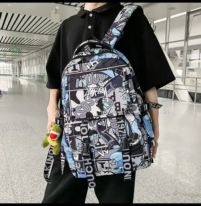 A high-capacity One Piece Luffy Backpack featuring a vibrant graffiti print of Monkey D. Luffy, designed as a durable school bag for middle and high students.