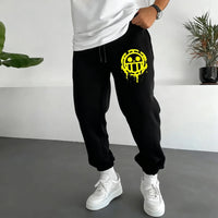 Trendy One Piece Graphic Joggers featuring anime character prints, designed as casual Y2K streetwear sweatpants for men and women.